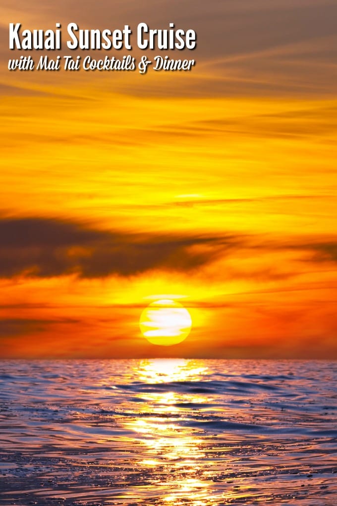 A Kauai Sunset Cruise is never quite the same twice. Here the sun looks like an orange fireball as it sinks down into the ocean.