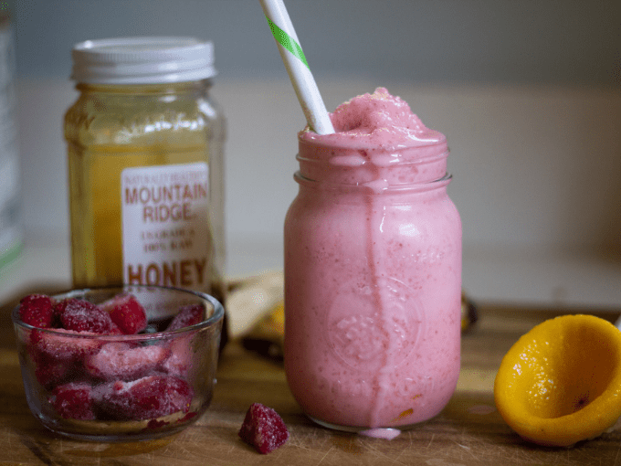 Strawberry smoothie with frozen strawberries, lemon and honey
