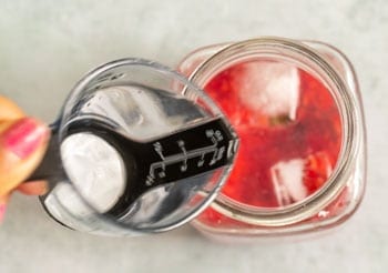 Rum added to the mojito glass