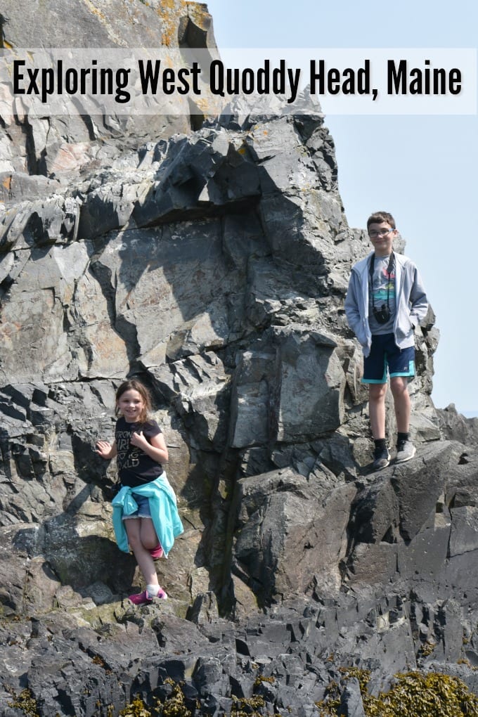 Children climb on rocks at West Quoddy Head Lighthouse