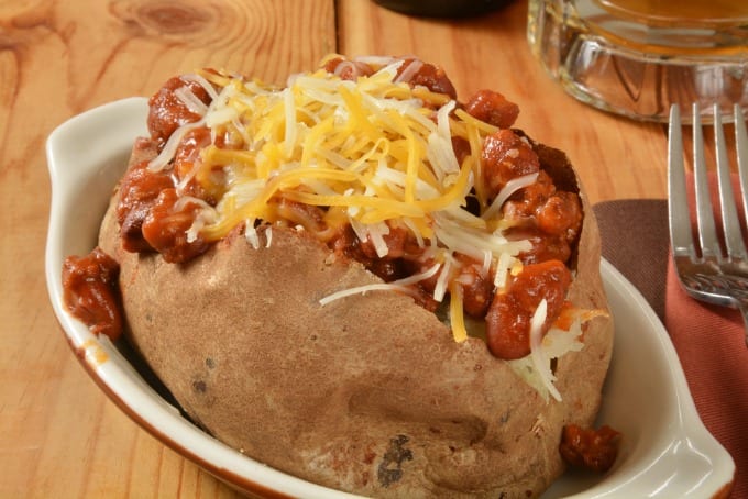 Closeup of a baked potato with stuffed with chili and cheese