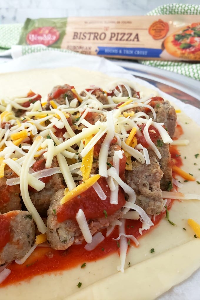 Meatballs, cheese and sauce piled on a Bistro style pizza crust to be made into a calzone.