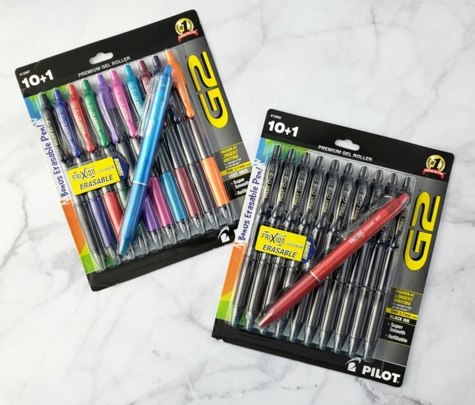 two packages of pens on a marble counter