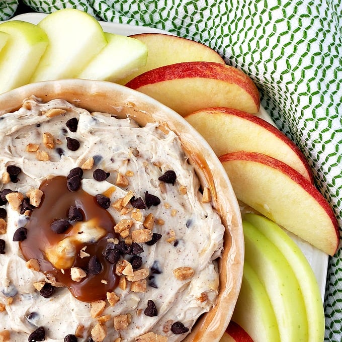 close up of apple toffee dip with slices of fresh apples