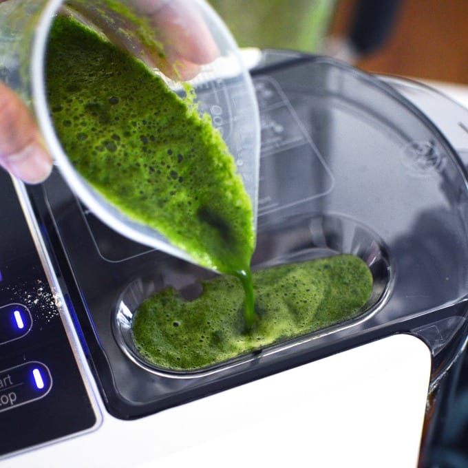 spinach juice is poured into a pasta maker