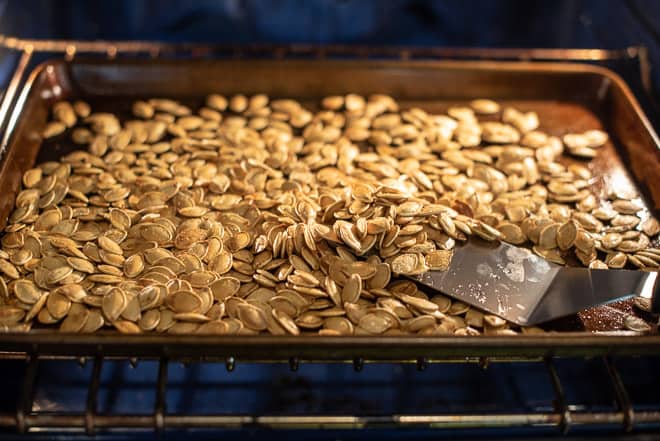 Roasted Pumpkin Seeds on a tray.