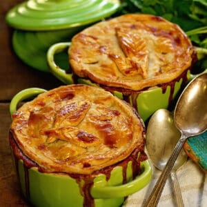 Two green bowls filled with Homemade Turkey Pot Pie.