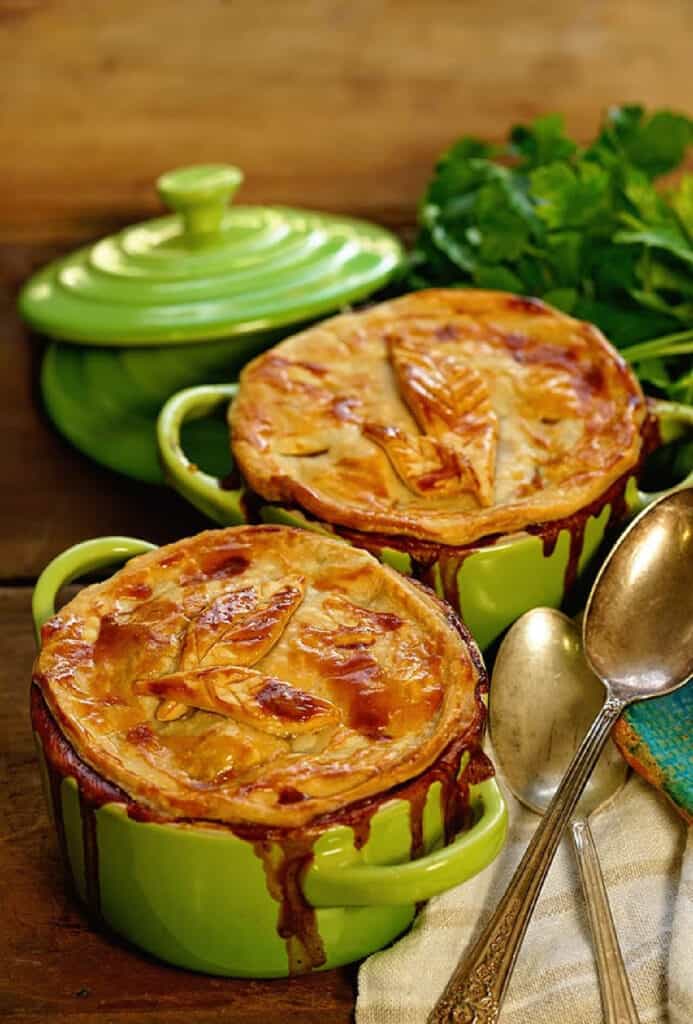 Two green bowls filled with Homemade Turkey Pot Pie.