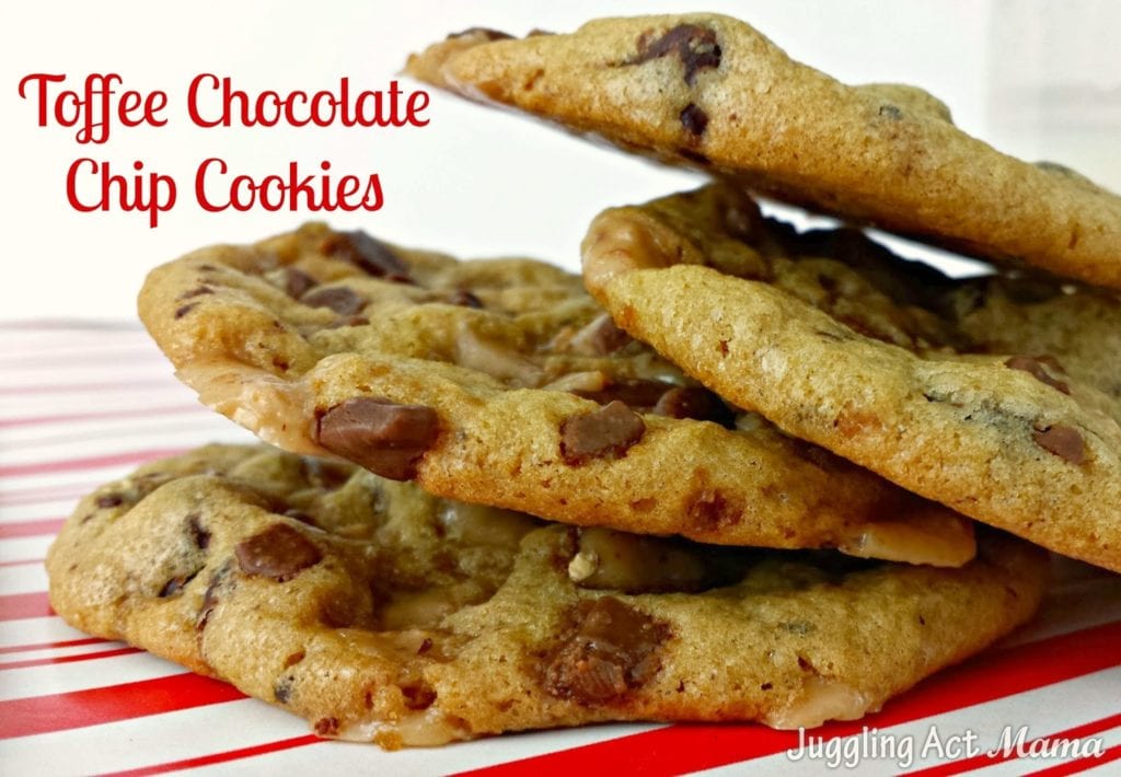 Stack of chocolate chip toffee cookies on a red and white striped surface.