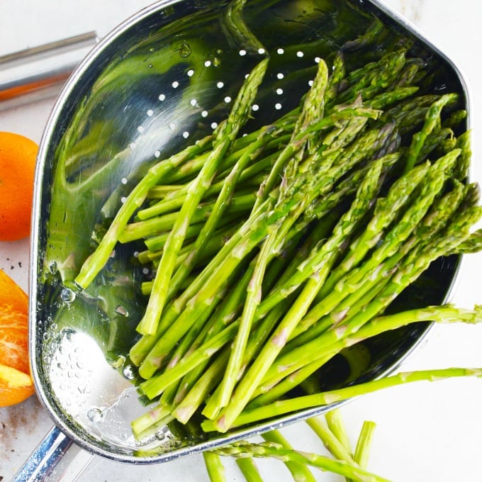 tender asparagus in a colander