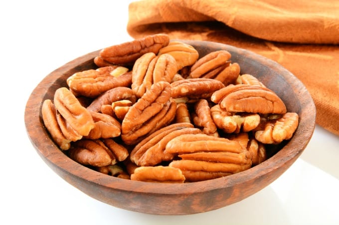 Pecans in a wooden bowl.