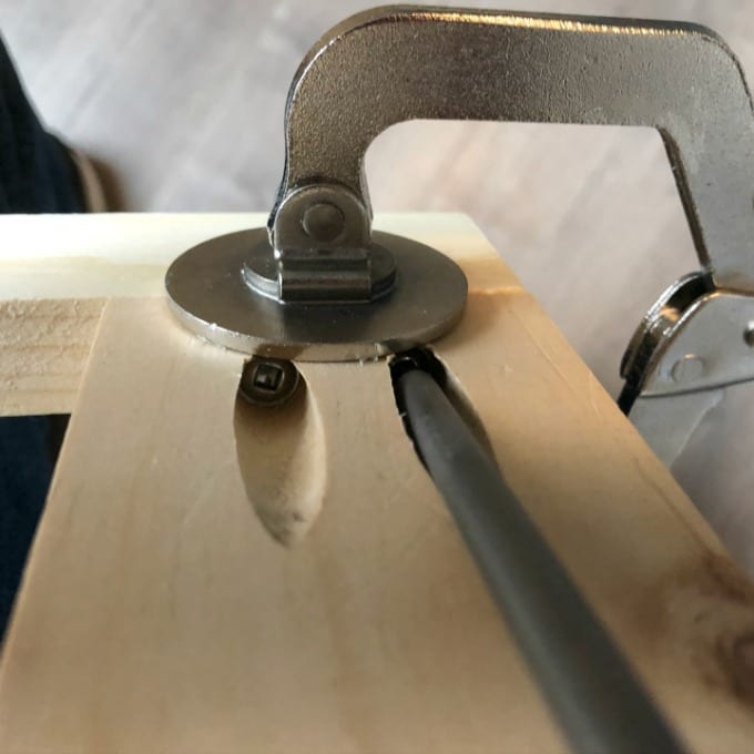 Clamps and pocket screw holes in wood to build DIY Floating Wood Shelves