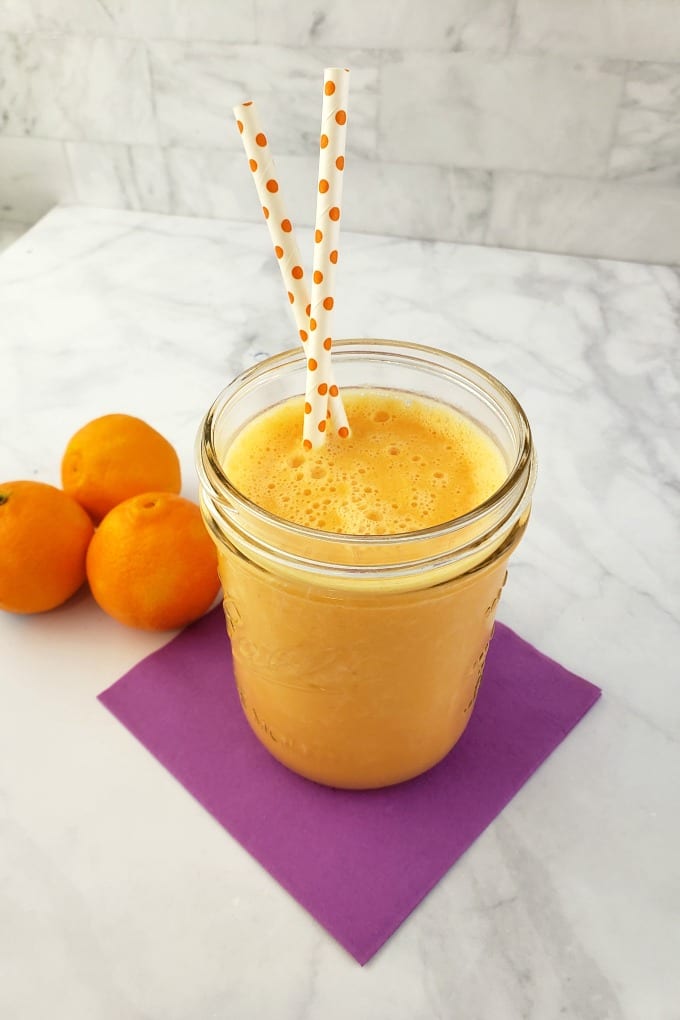 Clementine smoothie in a mason jar.