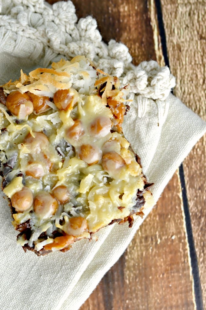 Samoa Bars - a cookie bar on cream colored napkins and wooden table