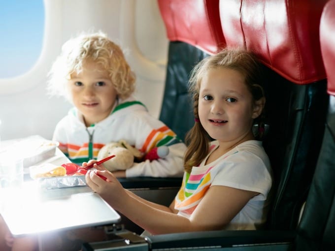 two children on a plane