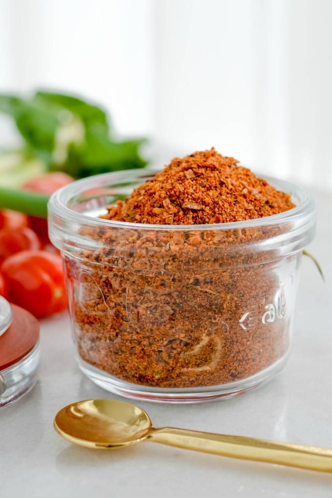 close up of a jar containing at home taco seasoning mix