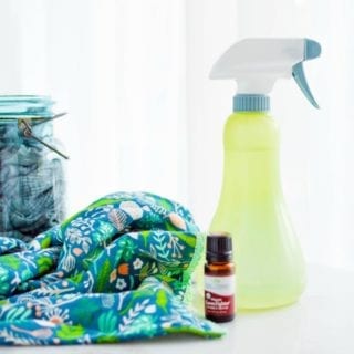 Yellow and white spray bottle on a colored rag