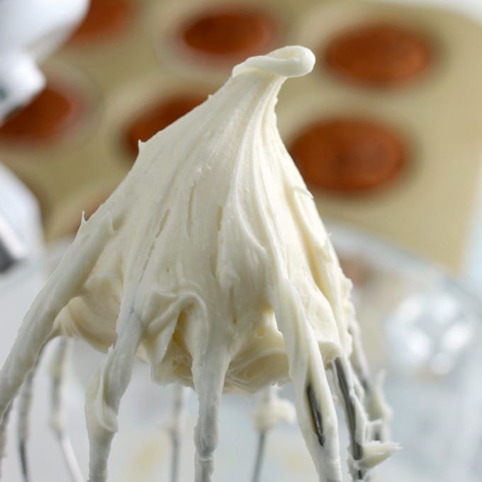 cream cheese frosting on a whisk attachment