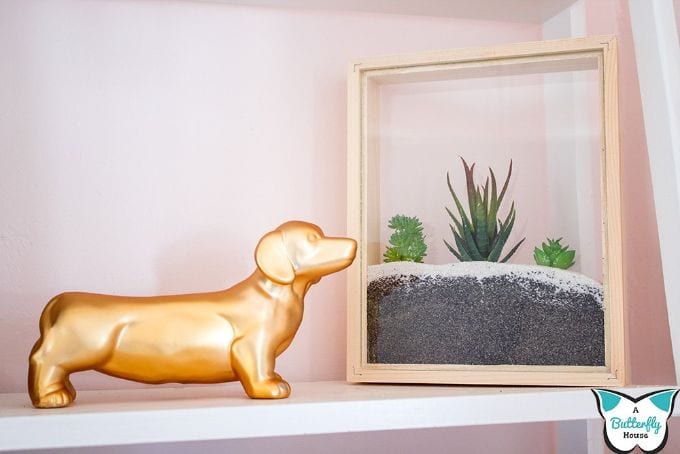 picture frame faux succulent planter on a shelf