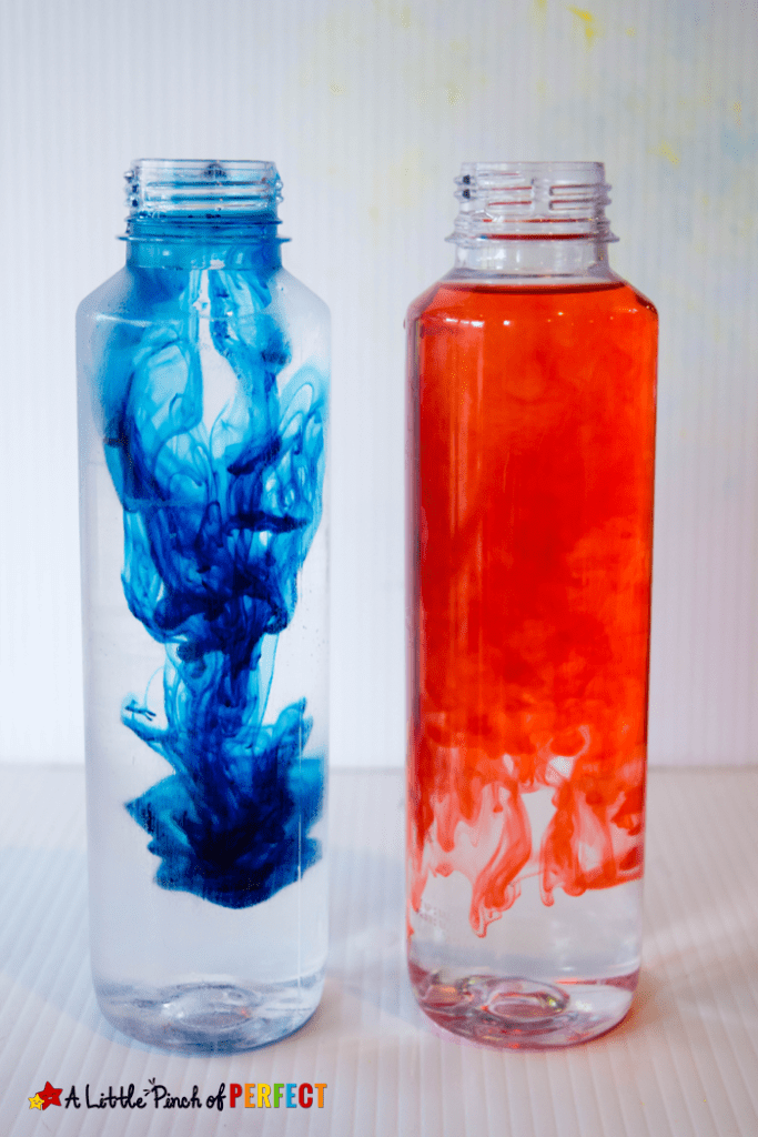 Two clear bottles, one filled with red food coloring, the other with blue.
