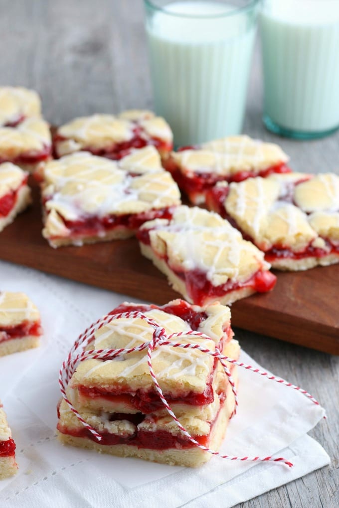 Cherry Pie Bars Recipe - Close up image of cherry pie bars, stacked and tied with kitchen twine for gifting.