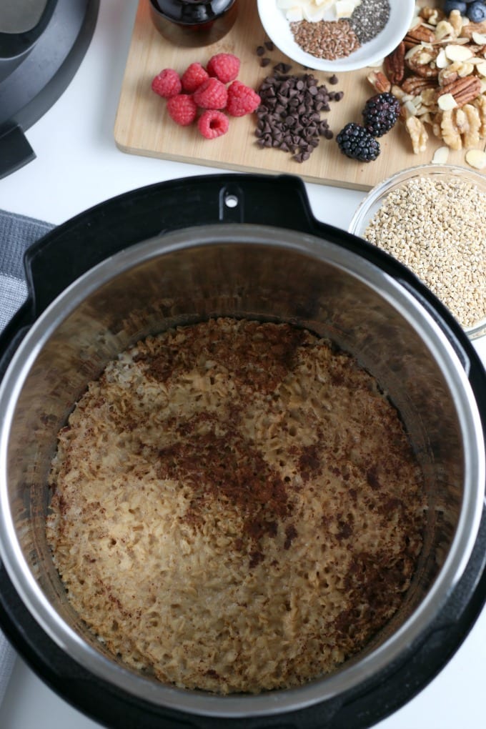 Instant pot oatmeal in an instant pot topped with spices.