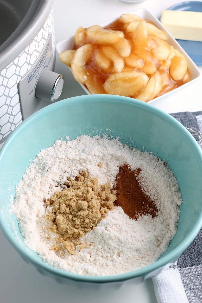 Step-by-Step image for how to make apple cobbler in a slow cooker.