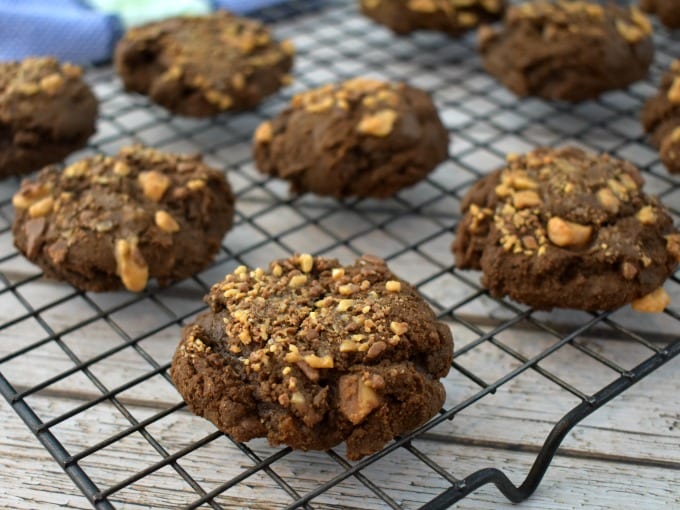 Double chocolate toffee cookies cooling on a cooling rack.