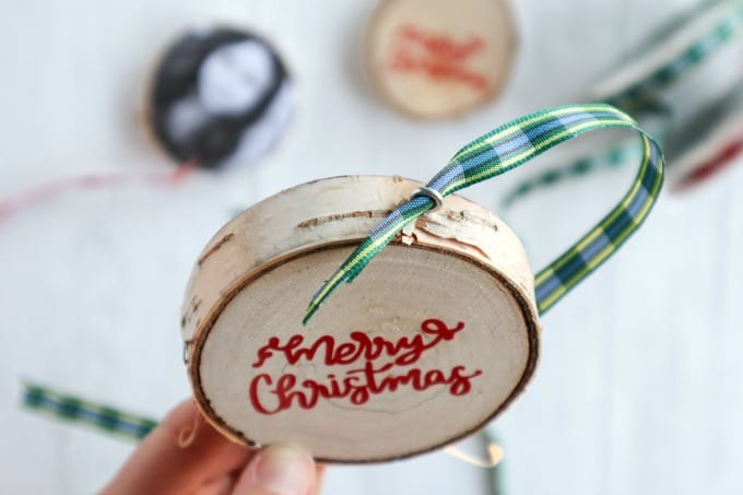 Close up of how to add a hook onto a birchwood slice.