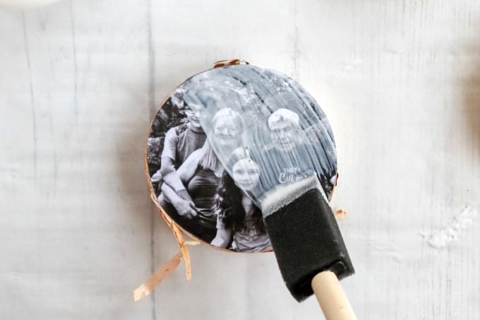 Instructions for creating this birchwood slice photo ornament craft using mod podge.