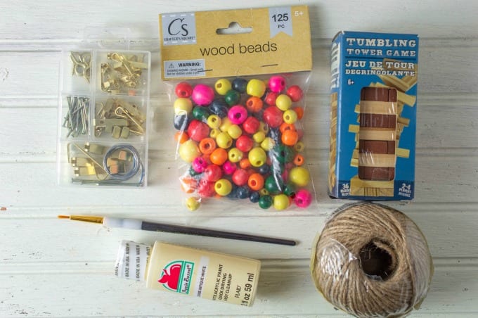 Materials needed to make painted wooden Christmas ornaments.