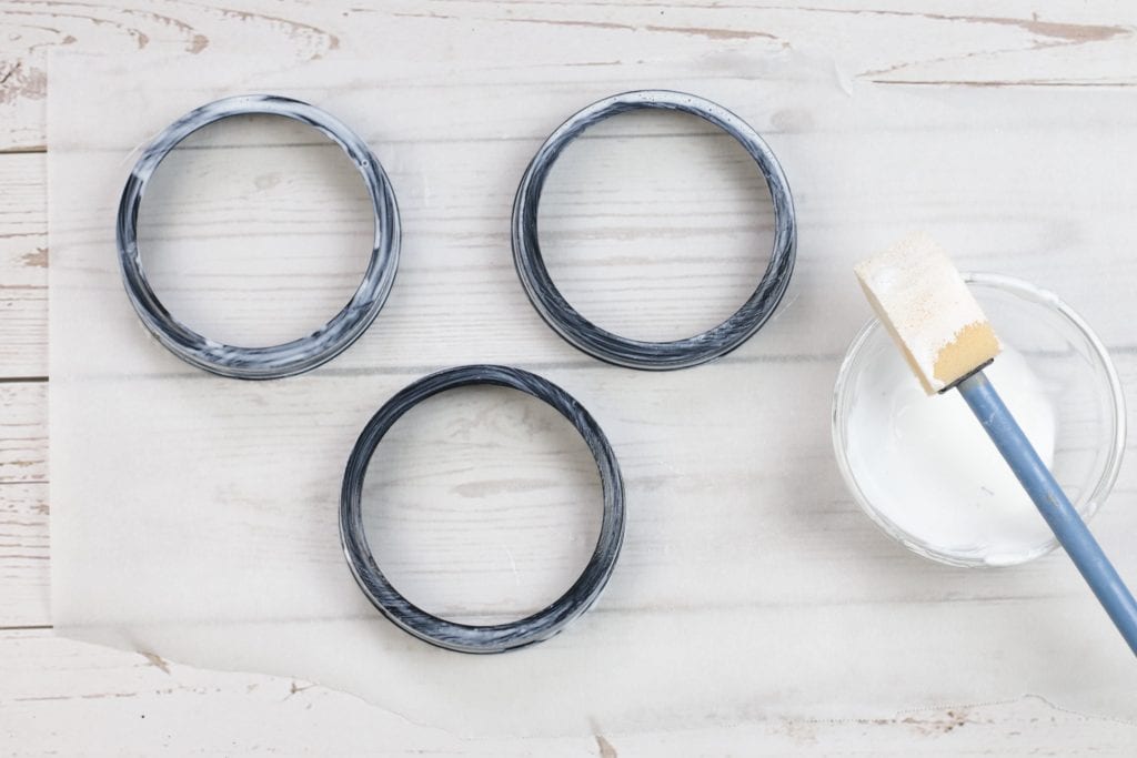 Mason Jar Lid Coasters DIY project:
step by step instructions for making Mason Jar Lid Coasters with mason jar lids, mod podge paint, fabric, and cork.