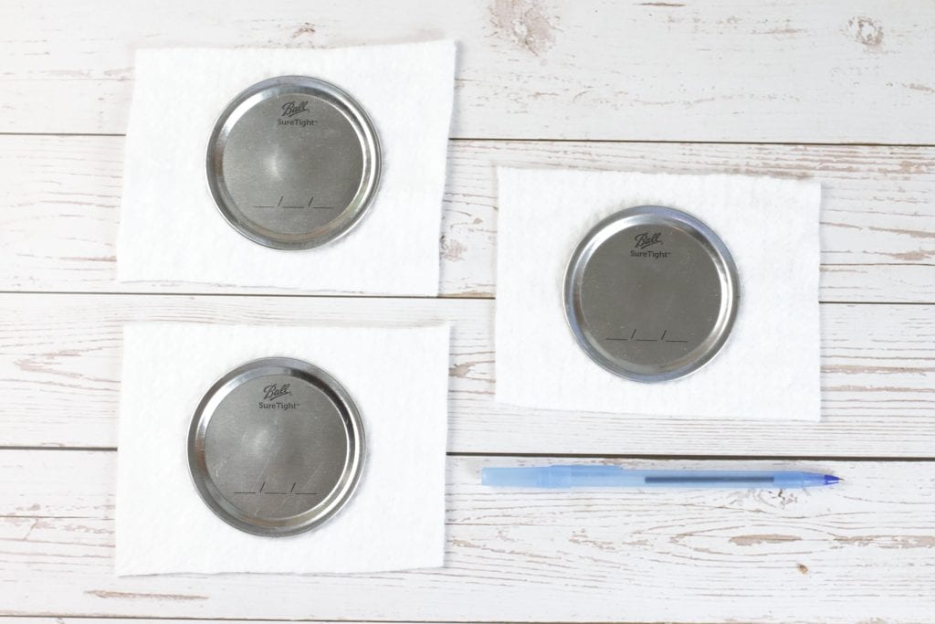 Mason Jar Lid Coasters DIY project with Insul-Brite for a Double-Sided Coffee Coaster:
step by step instructions for making with mason jar lids, paint, fabric, and cork.