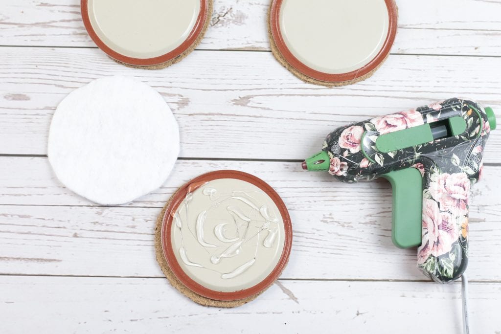 Mason Jar Lid Coasters DIY project with Insul-Brite for a Double-Sided Coffee Coaster:
step by step instructions for making with mason jar lids, paint, fabric, cork and a glue gun.