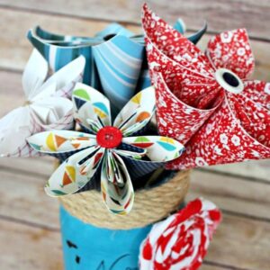 Paper flowers in a painted mason jar.
