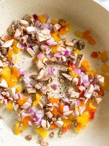 How to Make egg quesadillas: cook the veggies.