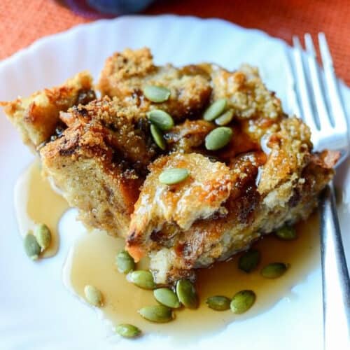 Pumpkin French Toast Casserole on a white plate with a fork.