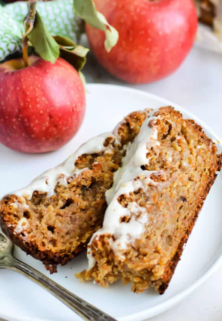 slides of Apple Carrot Bread topped with lemon glaze on a white plate