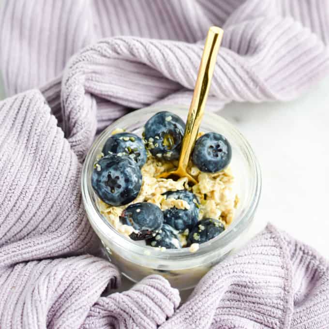 Close up of blueberry overnight oats in a jar.