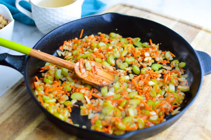 Diced vegetables in a skillet.