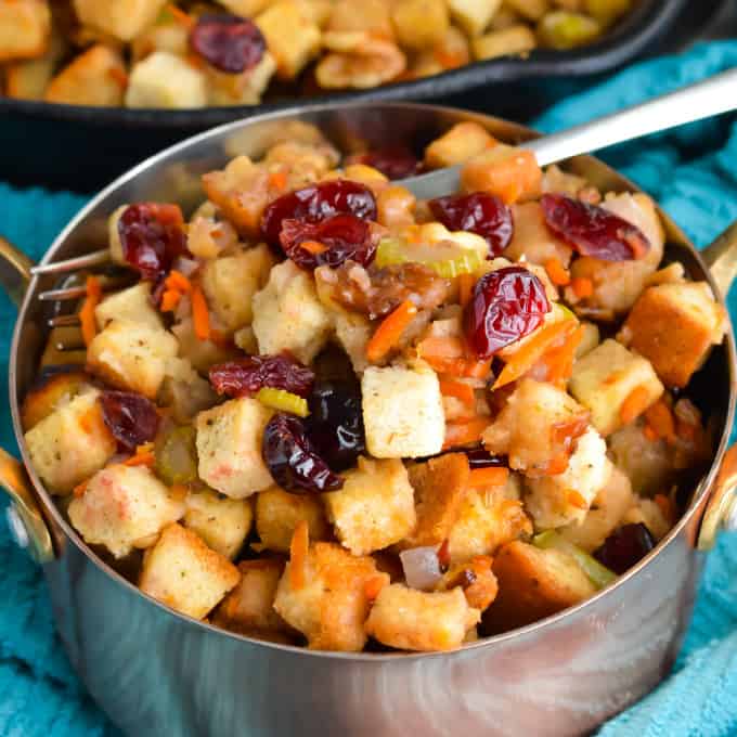 Close up of cranberry walnut stuffing in a bowl.