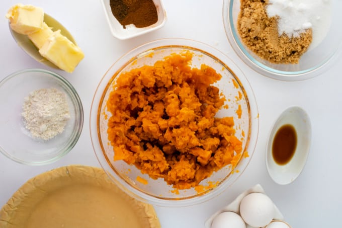 Bowls of ingredients to make sweet potato pie recipe.