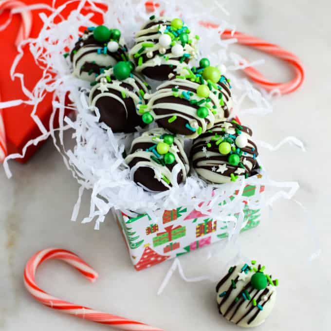 Oreo Truffle Balls in a gift box with tissue paper shreds.