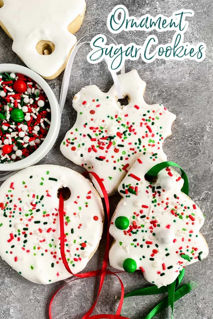 Top-down image of ornament sugar cookies topped with sprinkles and royal icing.