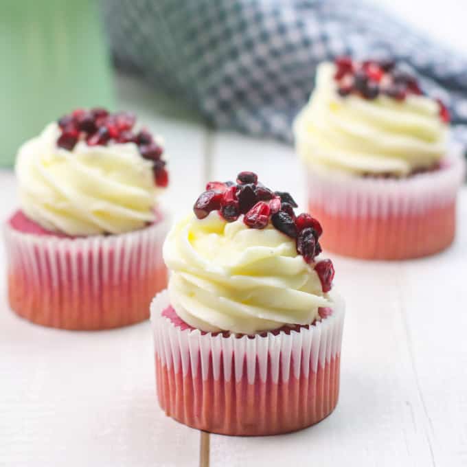 Three pomegranate cupcakes.