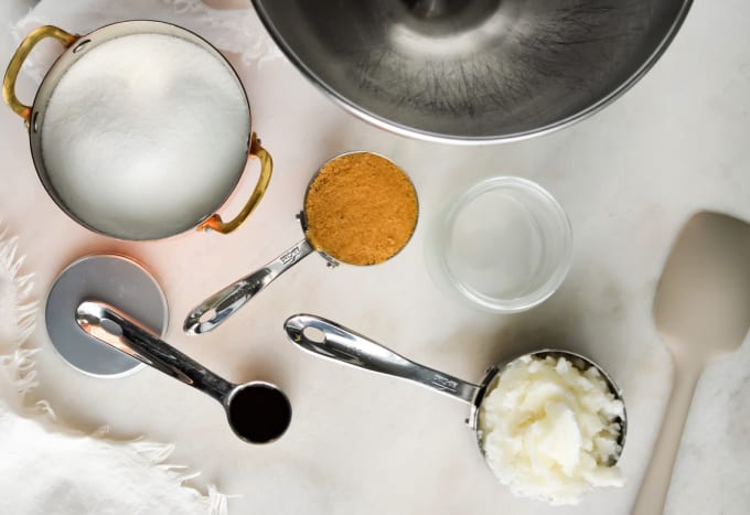 Top down view of ingredients and tools to make sugar cookie body scrub.
