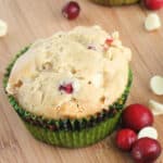 Square, close up image of cranberry white chocolate muffins.