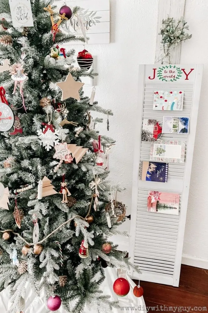 A DIY christmas card display holder made from a shutter.