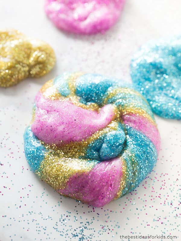 unicorn slime is made up of 3 different colors of glitter slime.