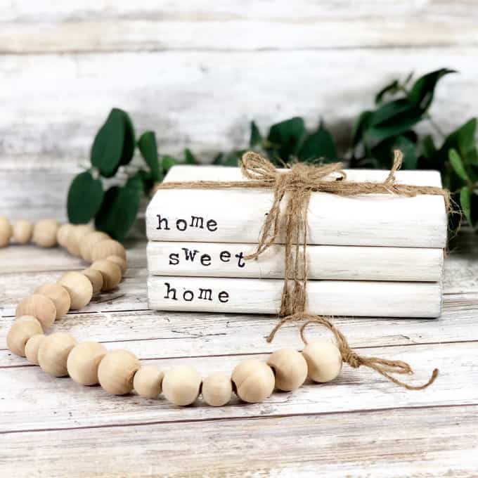 Front view of stacked book decor with the words home sweet home on the spines. 